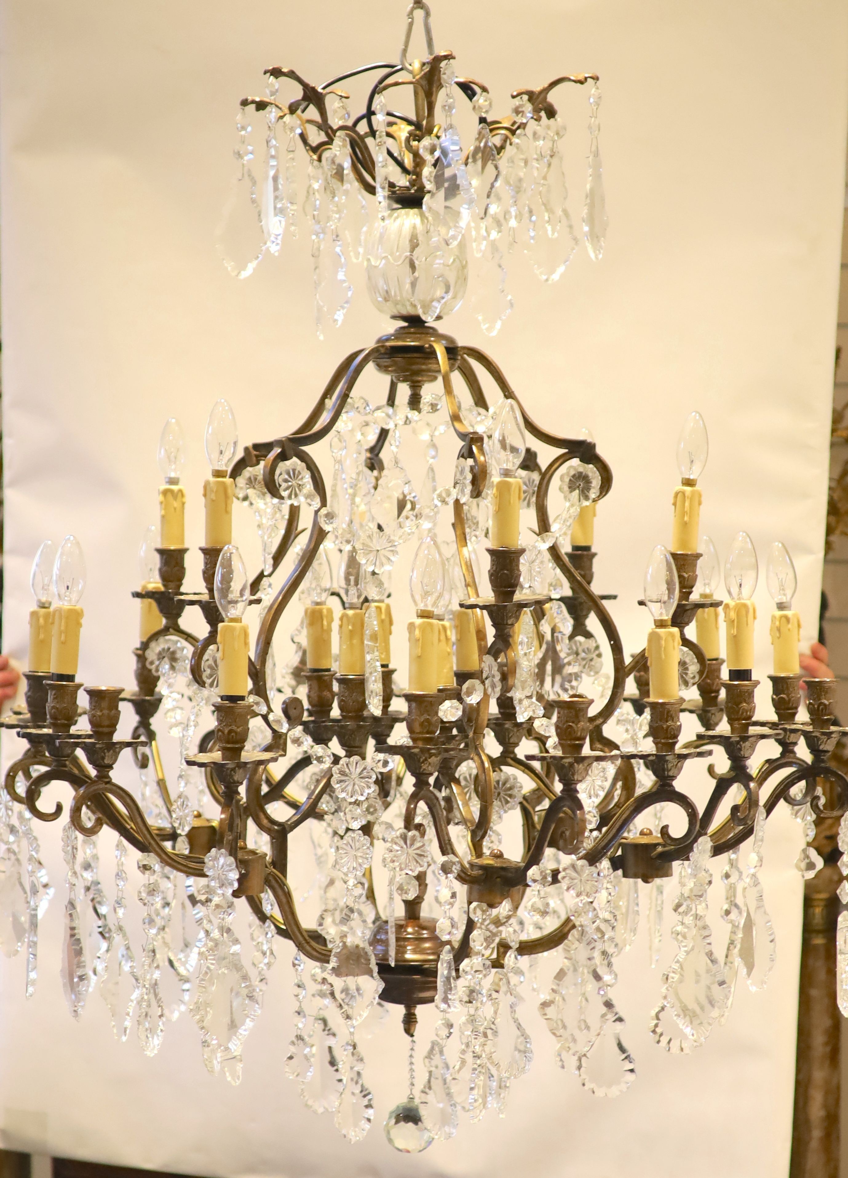 An 18th century style bronzed metal, cut glass 30 light chandelier by Christopher Wray, approximately 123 cm high